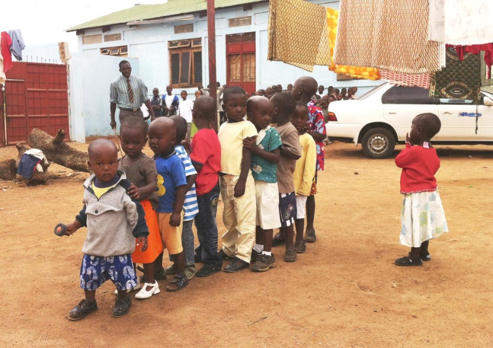 The youngest children at Watoto Wa Africa lining up ready to be checked