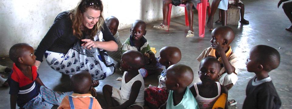 Prue Preston talking with children in Tanzania
